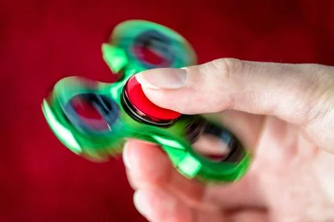Fidget spinner in hand Foto stock