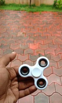 A fidget spinner in a hands Stock Photos