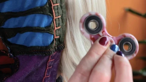 Fidget spinner spinning in hand 02 Stock Footage 107572581