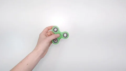 Fidget Spinner Spinning in Hand Stock Footage 100645684