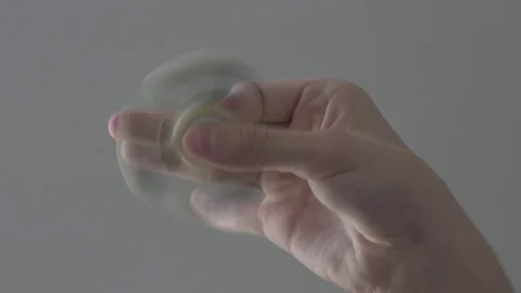 Fidgeti spinner rotating on hand 스톡 동영상 76750615