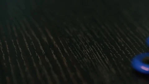 Fidgeting spinner, hand spinner rotating Stock Footage 77066559