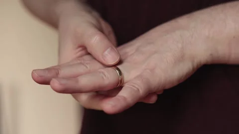 Fidgeting with wedding ring 1 - Slow Stock Footage 326265332