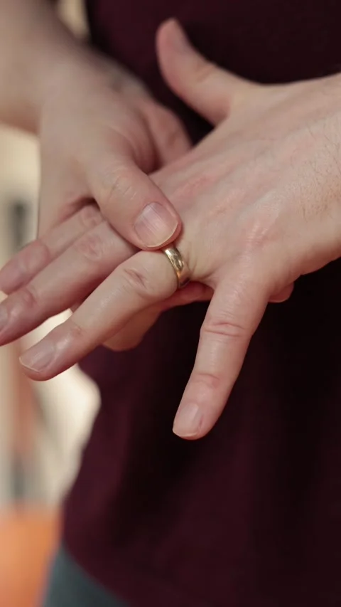 Fidgeting with wedding ring 1 - Vertical Slow Stock Footage 326265333