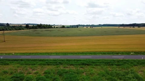 A field along the road going into the distance Stock Footage 161065963