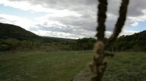 Field and hills with clouds, rack focus to grass seed Stock Footage 22322145