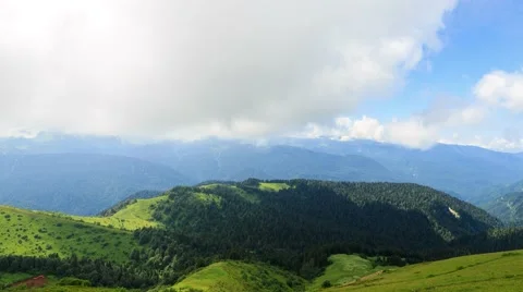 Field and mountains with forests. Time Lapse. Sochi, Russia. 1280x720 Vídeo Stock 53738871