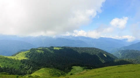 Field and mountains with forests. Zoom. TimeLapse. Sochi, Russia. 1280x720 스톡 동영상 53744706