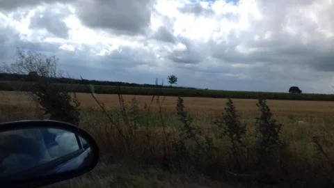 Field and Storm Clouds 1 Stock Photos