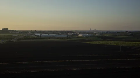 Field and town, evening Stock Footage 104877884
