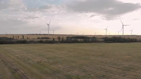 Field and wind generators in the distance4K Stock Footage 207808651