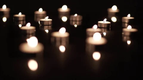 Field of Candles on Black Stock Footage 72492047