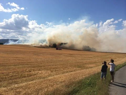 Field caught on fire Stock Photos