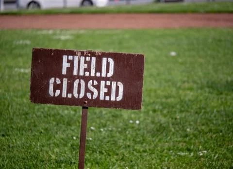 Field closed sign blocking access to a field in a park Stock Photos