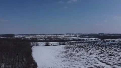 Field Covered In Snow Aerial view in Reverse Stock Footage 149758739
