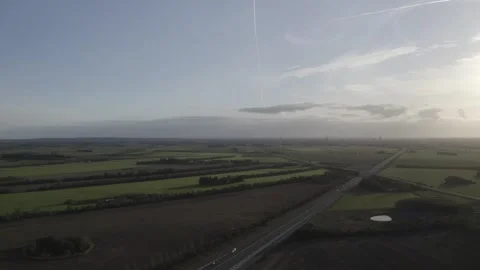 Field in denmark with green marks and windmills Stock Footage 165877579