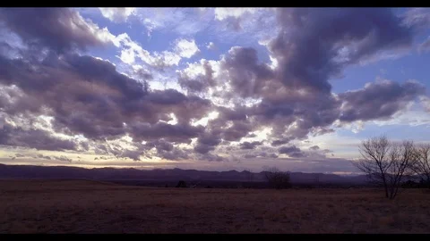 Field dolly mountains sunset Stock Footage 73532925