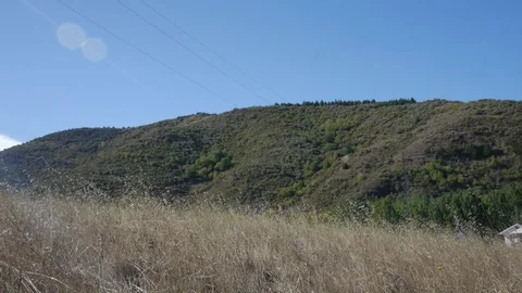 Field with dry grass in the mountains. Video stock 80248796