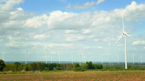 Field of electrical turbines background over blue sky Stock Footage 269097885