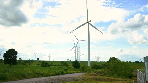 Field of electrical turbines background over blue sky Stock Footage 269097924