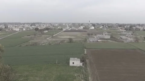 Field Flyover Panning Down Stock Footage 227722533