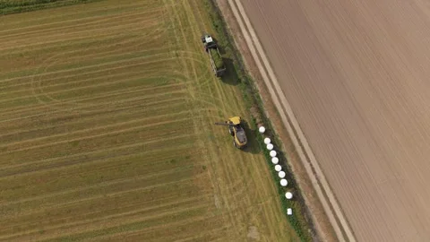 Field forage transfer system aerial view Stock Footage 334780970