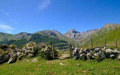 Field gate in mountain landscape, rustic wooden door Stock Photos