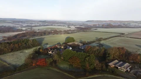 A field with a house in the middle of it Stock Footage 295371189
