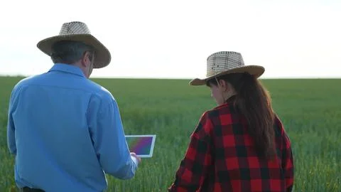 Field inspection with tablet, Agricultural progress, High-tech farmers, Future Stock Photos