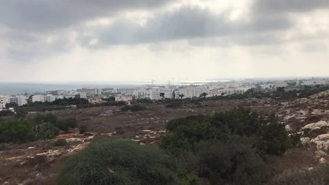 Field Landscape Against Cloudy Sky and City at the Background Video stock 101254619