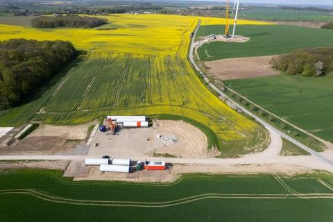 On a field lie the components for a new wind turbine Stock Photos