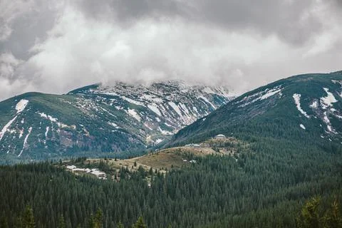 A field with a mountain in the background Stock Photos