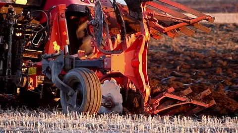 Field plowing in sunset Stock Footage 48846437
