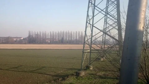 Field with power lines Stock Footage 76255475