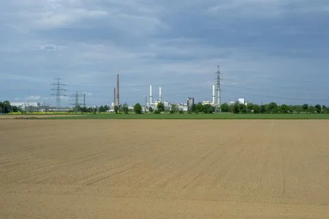 Field with production in the background Stock Photos