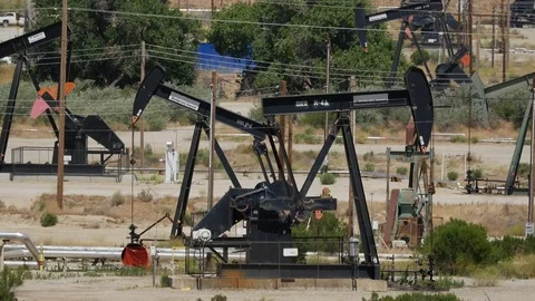 A field of Pump jacks extracting oil from the ground Stock Footage 78112357