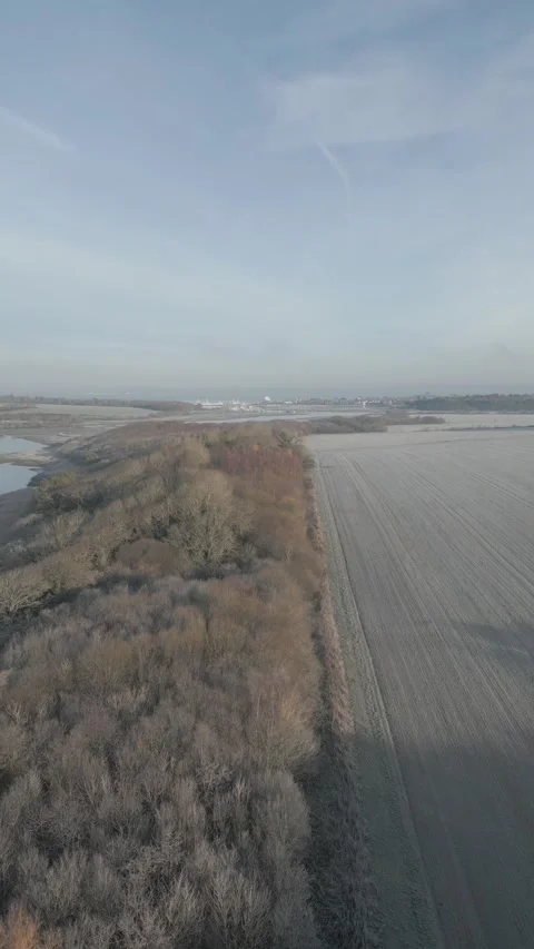 A field with a river in the background Stock Footage 298269120