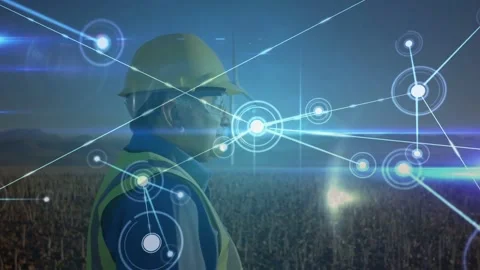 Field tech standing in profile as HUD marker appearing, nodes spreading, network Stock Footage 331701481