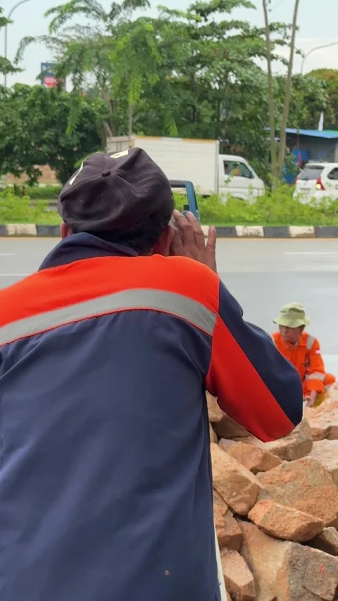 Field technician conducting precise topographical measurements for urban in.. Stock Footage 337287904
