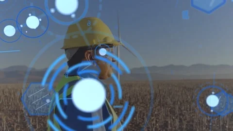 Field technician inspecting wind turbine, HUD activating and rotating data nodes Video stock 333936906