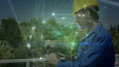 Field technician tapping tablet on railing, activating technology overlay while Stock Footage 332613630