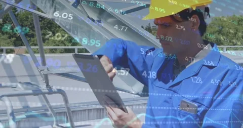 Field technician tapping tablet then pointing at solar module, monitoring Stock Footage 334115520