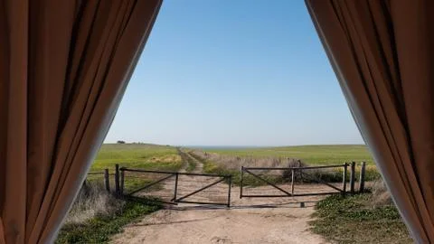 Field through the curtains Stock Photos