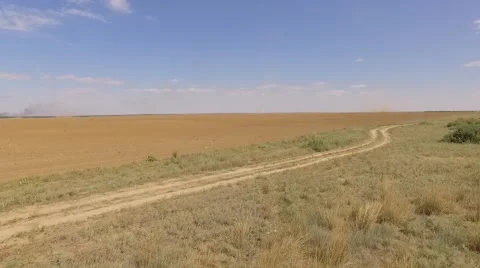Field with tornado at the background Stock Footage 68863285