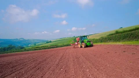 Field work on a tractor from a drone, Devon, England, Europe Stock-Footage 160998226
