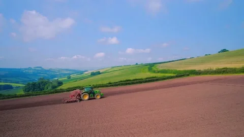 Field work on a tractor from a drone, Devon, England, Europe Stock Footage 160998818
