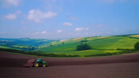 Field work on a tractor from a drone, Devon, England, Europe Stock Footage 160998870