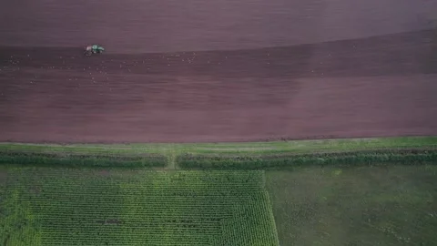 Field work on a tractor from a drone, Devon, England, Europe Stock-Footage 161087845