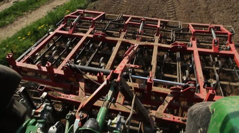 Field work. Tractor on the field. Harrowing a field. Stock Footage 62592908
