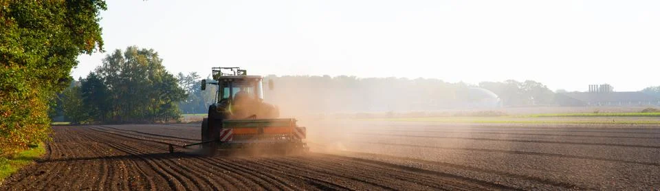 Field work with the tractor on the field Stock Photos